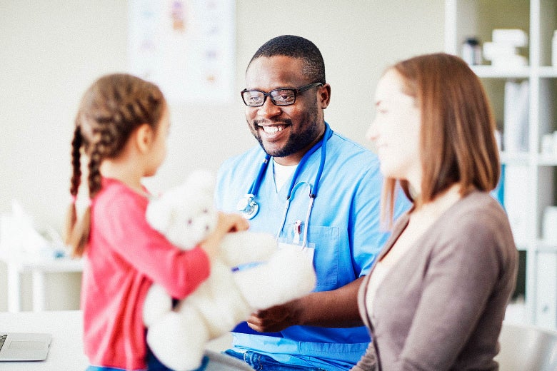 A doctor treating a child.